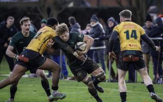 Charlie Fethany rides out a high tackle in the North Walsham game against Bury St Edmunds