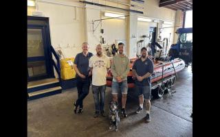 Rex and Mr Johnson meet with the RNLI volunteer crew